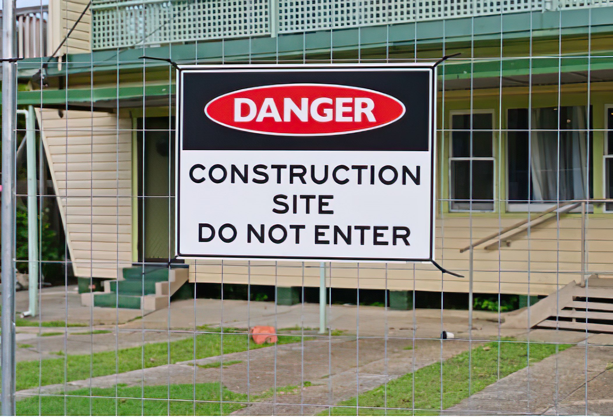 A high-quality image of a burned property being professionally boarded up