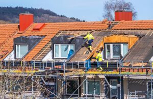 Fire-damaged house undergoing emergency restoration and cleanup