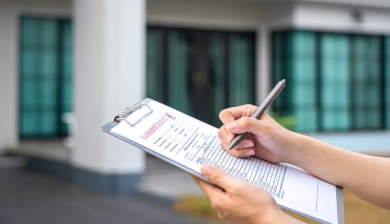 Homeowner creating an emergency checklist after fire damage
