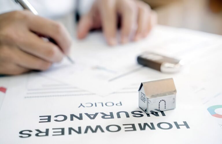Person reading homeowners insurance paperwork