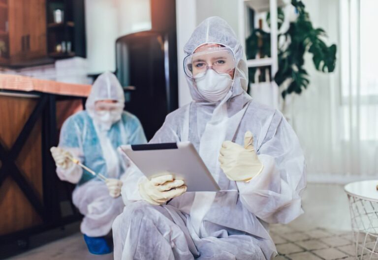 Professional mold remediation team working inside a home