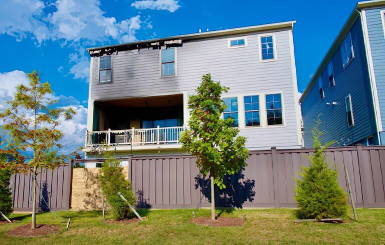 Fire-damaged home without board up shows weather and vandalism damage