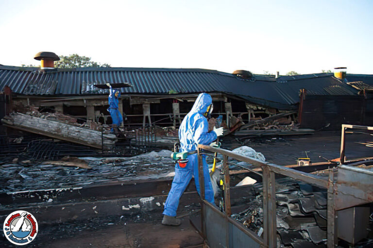 Fire restoration team inspecting fire-damaged property