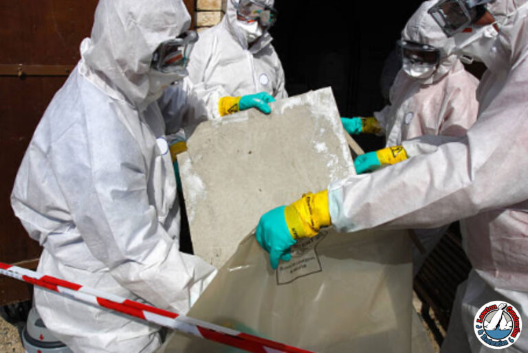 Certified asbestos removal team in protective gear handling asbestos waste