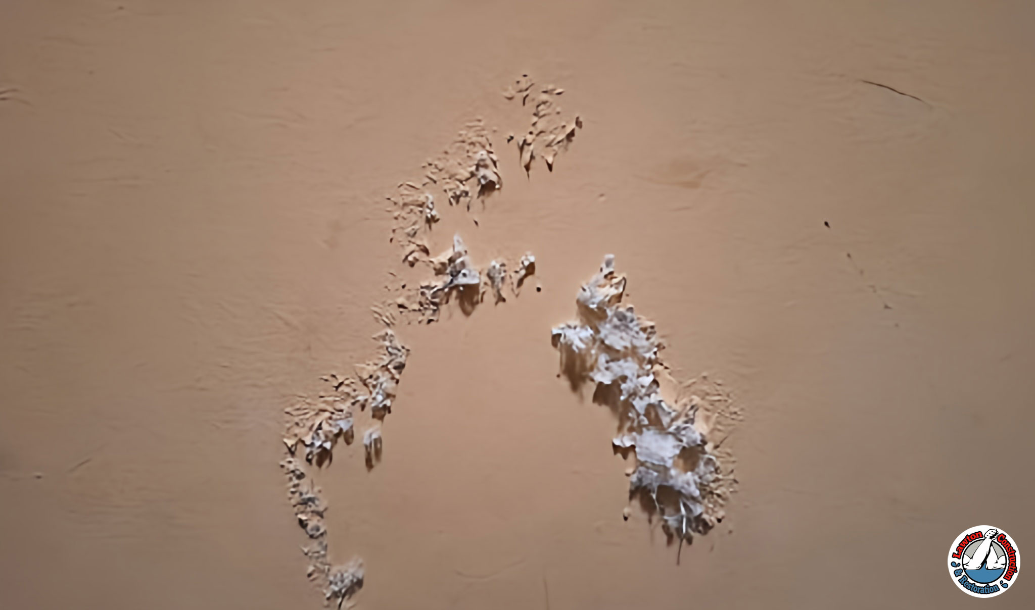 Chipped paint on a wall with visible lead dust buildup
