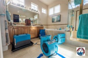 Structural drying equipment removing moisture from a water-damaged bathroom in a Sacramento-area home