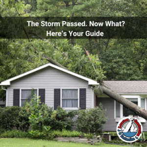 Fallen tree on roof of home after storm damage with Lawton Construction & Restoration logo